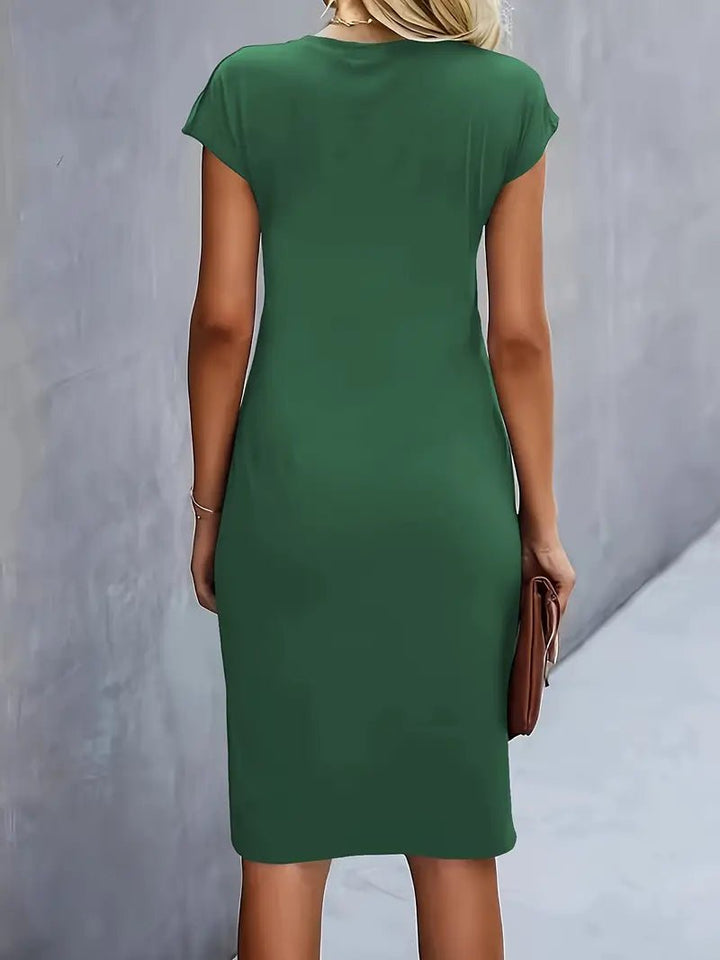 Smart casual black work dress, cap sleeve, ruched waist, designed to be figure-flattering.