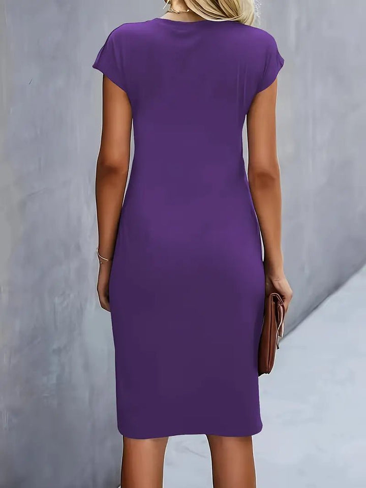 Black office dress, cap sleeve, bodycon midi, with a professional twist-ruched detail.