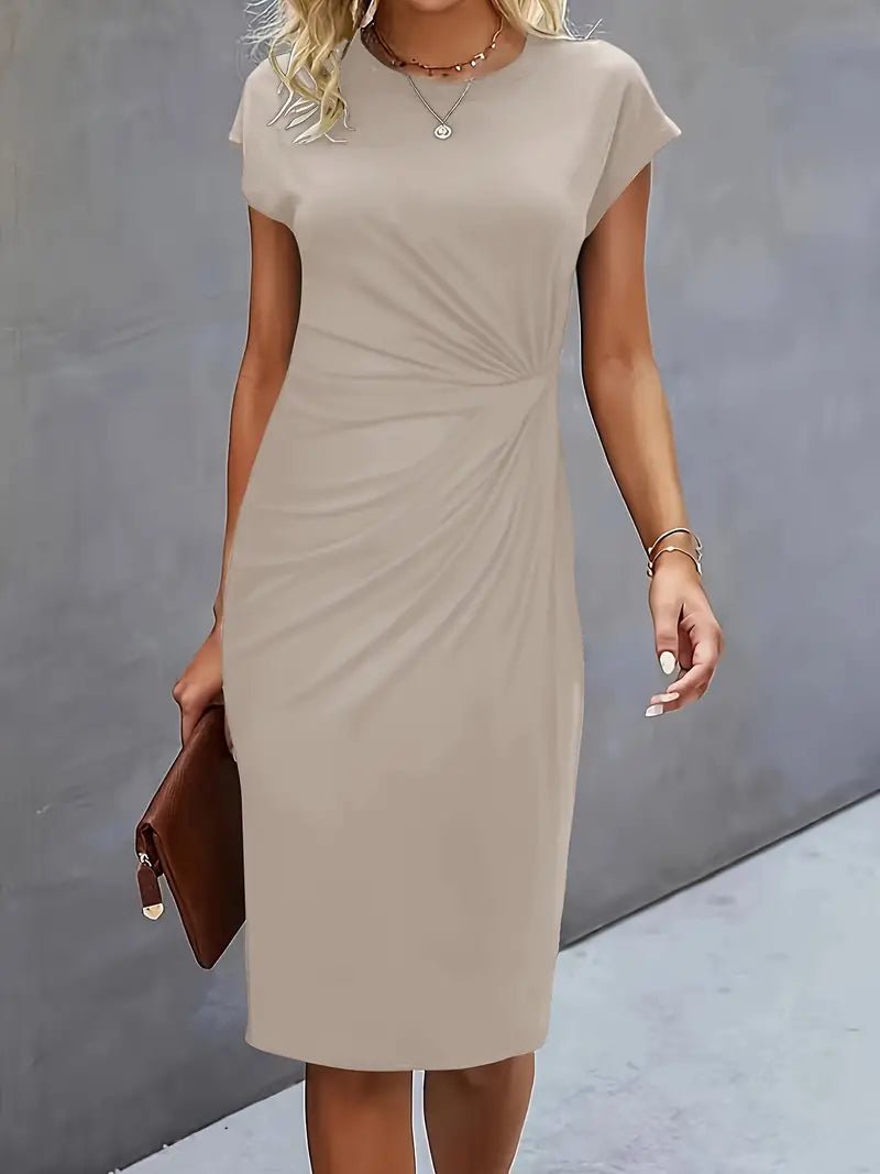 Smart casual black work dress, a bodycon midi with ruched waist and cap sleeves, figure flattering.