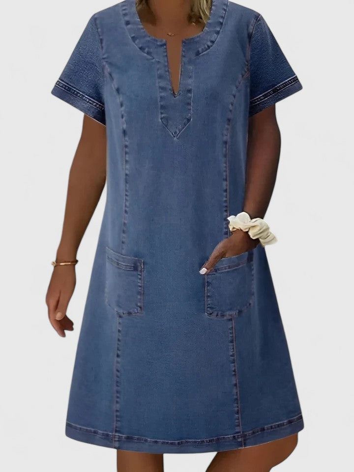 Blue flowy midi dress for women, comfortable and relaxed fit, with practical pockets. Perfect for summer casual wear.