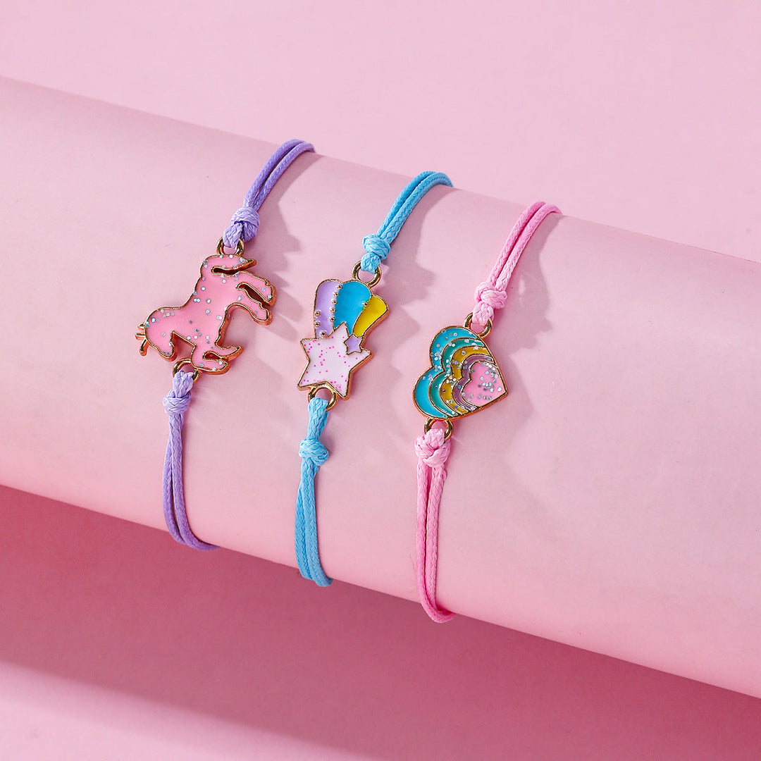 Blue girls' playful charm friendship bracelet set, perfect for young friends. Features multiple strands.