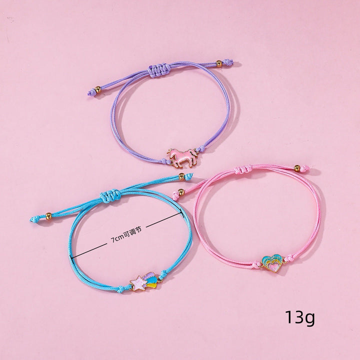 Playful blue girls' charm bracelet set featuring a cute unicorn charm. Ideal for children's jewelry.