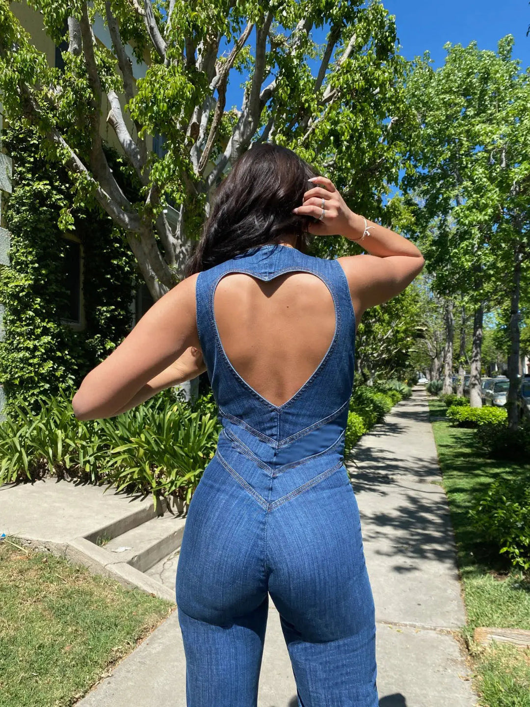 Trendy blue women's plunge neck fitted flared jumpsuit for bold fashion. Perfect for parties & special occasions.