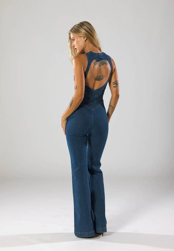 Bold blue women's fitted flared jumpsuit with a striking plunge neck. A fashion statement for evening events.