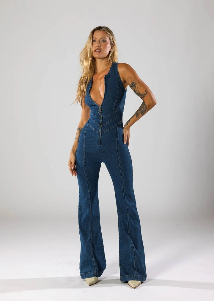 Elegant women's sleeveless blue jumpsuit, fitted waist & flared leg, featuring a sophisticated plunge neck.