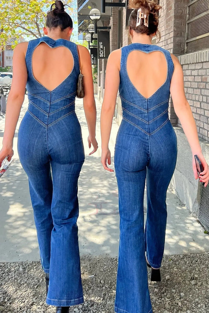 Fashionable blue women's sleeveless jumpsuit. Features a plunge neck, fitted bodice, and elegant flared pants.
