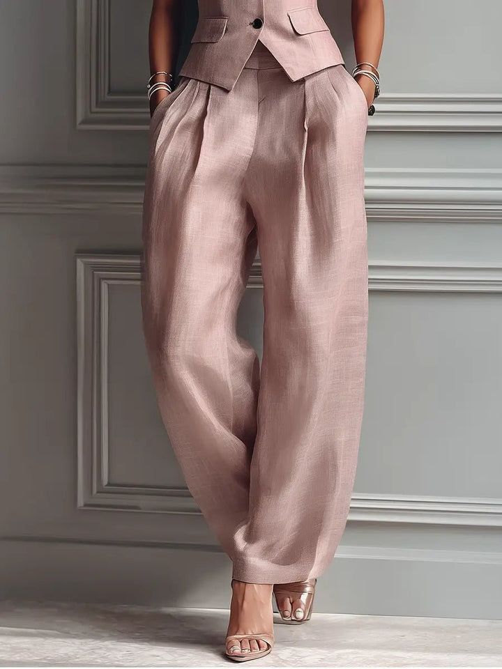 Blush pink linen two-piece set for women with sleeveless vest and comfortable wide-leg trousers, ideal for summer.