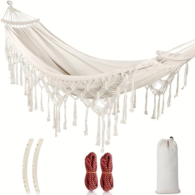 Bohemian double cotton hammock with tassels, perfect for outdoor garden relaxation & decor.
