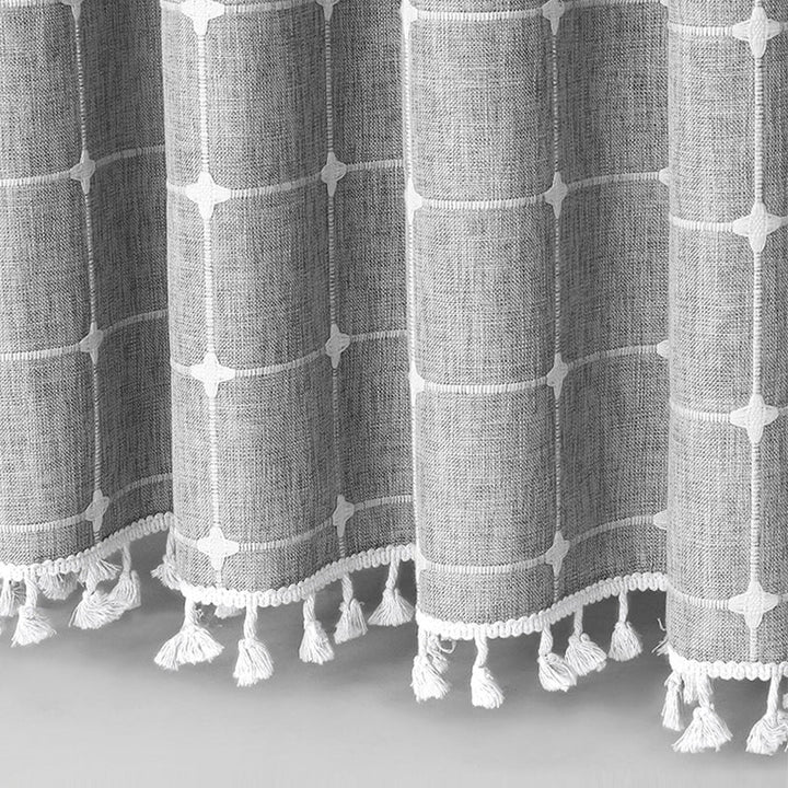 Durable waterproof bohemian farmhouse shower curtain in linen fabric with stylish tassels.