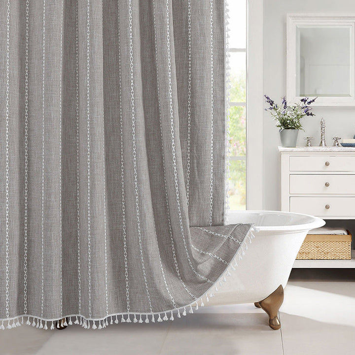 Natural linen look waterproof shower curtain, bohemian farmhouse design with elegant tassel accents.