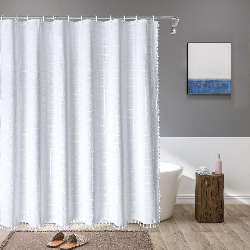 Bathroom decor: Waterproof linen bohemian farmhouse shower curtain with decorative tassel fringe.
