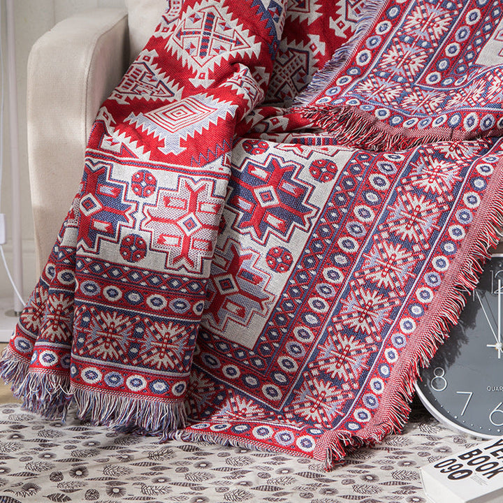 Knitted bohemian sofa throw blanket with beautiful tassels. Perfect for cozy spaces.