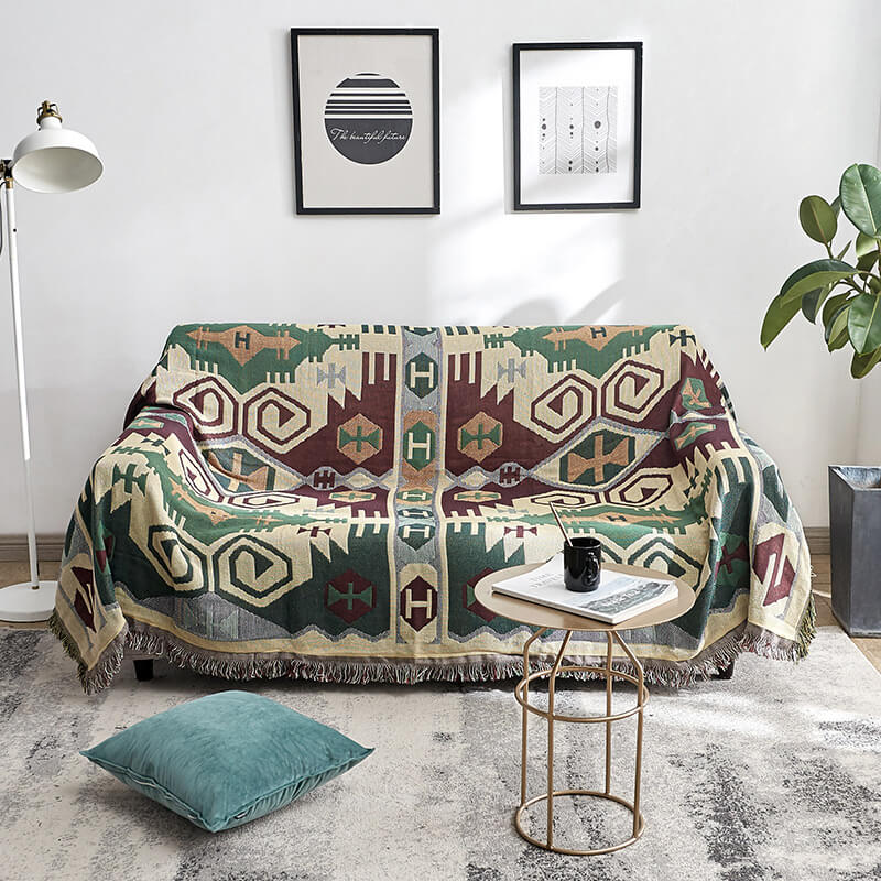 Stylish bohemian knitted blanket with tassels. A reversible sofa throw accent.
