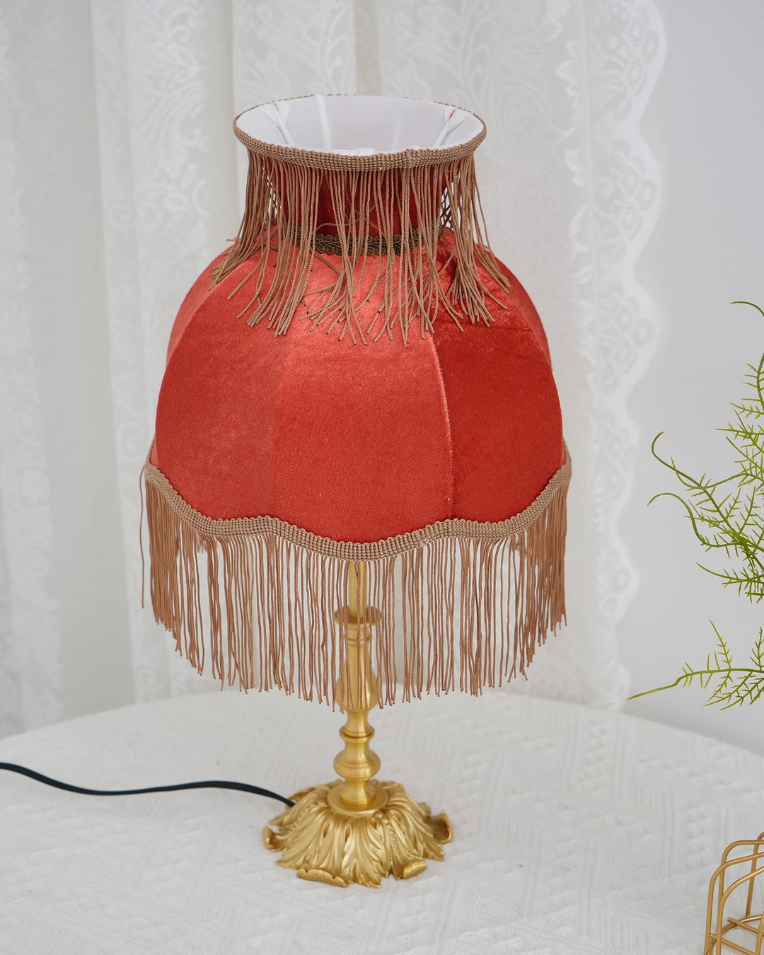 Warm glow table lamp: red bohemian, featuring decorative tassels for a chic home look.