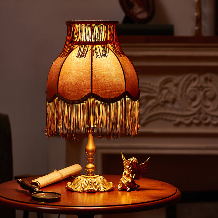 Elegant red bohemian table lamp, tassel details provide a unique decorative touch and soft light.