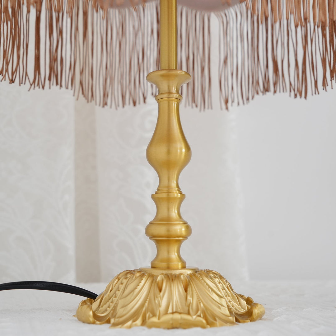 Bedroom table lamp: red, bohemian style, with a decorative tassel for warm, inviting ambiance.