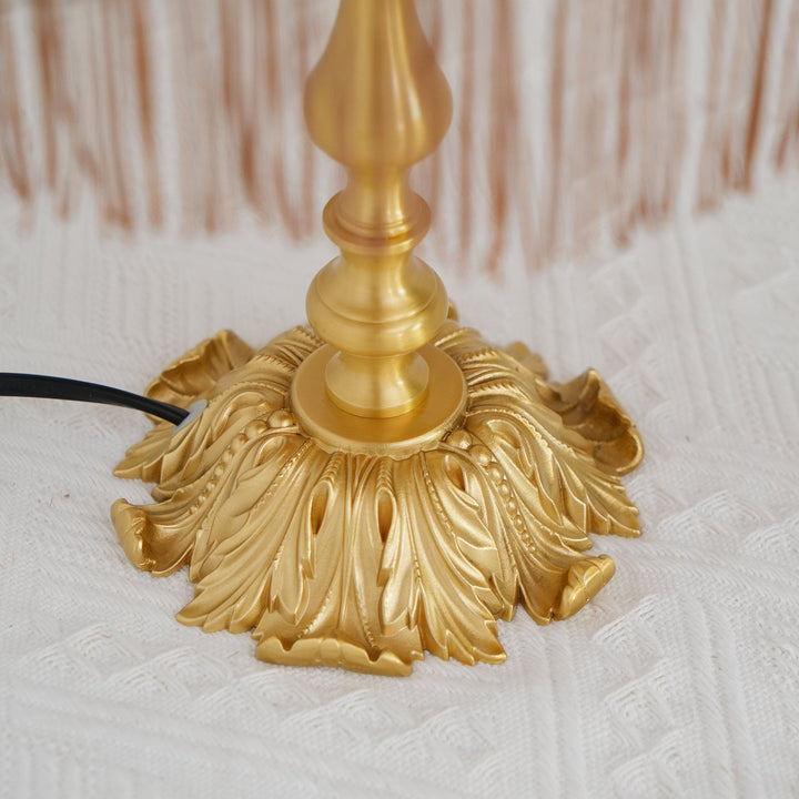 Classic home lighting: red bohemian tassel table lamp, a modern eclectic statement piece.