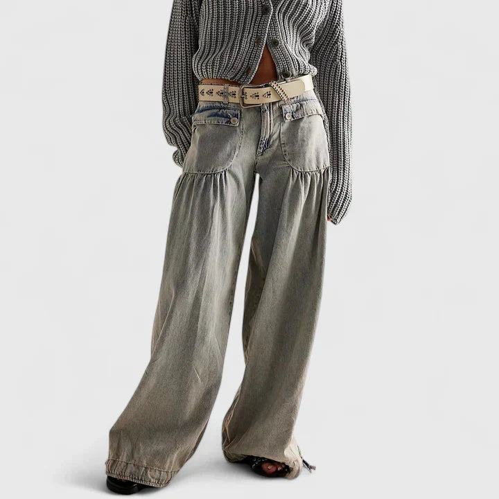 Elegant women's pleated wide leg trousers with a high-waist, embodying bohemian chic.