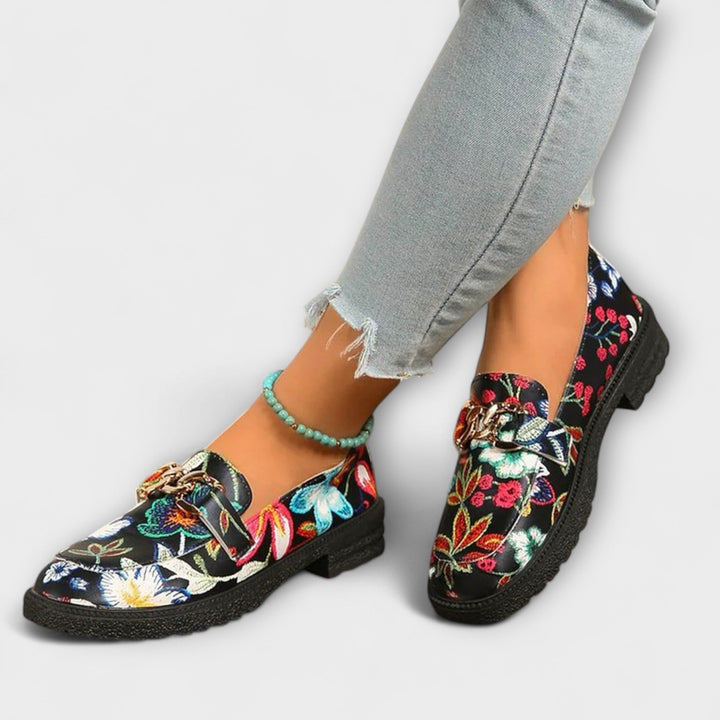 Statement women's loafers with a bold multicolor pattern, offering comfort and unique style for any outfit.