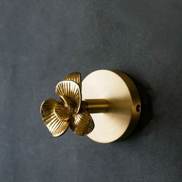 Contemporary brass animal wall hook rack with sleek gold accents, chic home decor.
