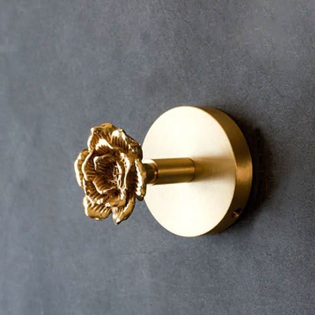 Gold-accented brass animal wall hook rack, decorative & functional home storage solution.