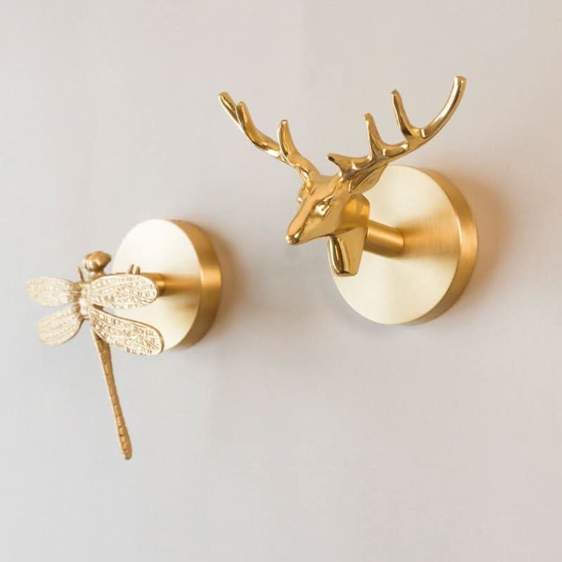 Elegant brass animal wall hanger with gold finish, unique decorative home accent.