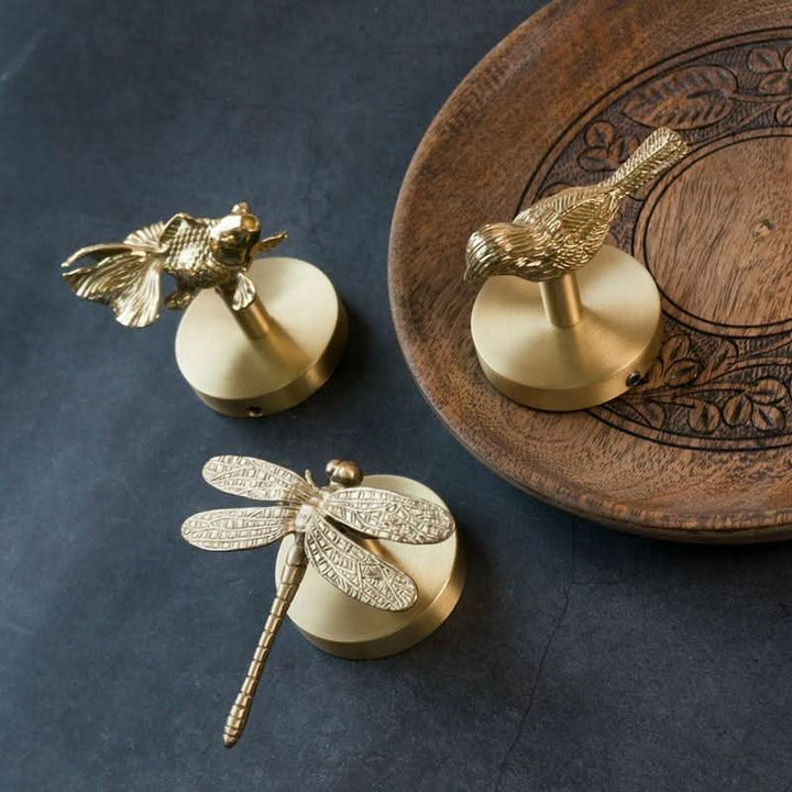 Unique brass animal wall hook rack with golden details, perfect for modern home decor.
