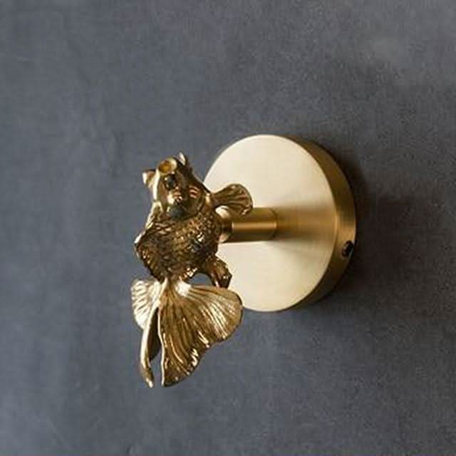 Decorative brass animal wall hook rack with gold accents for stylish home organization.