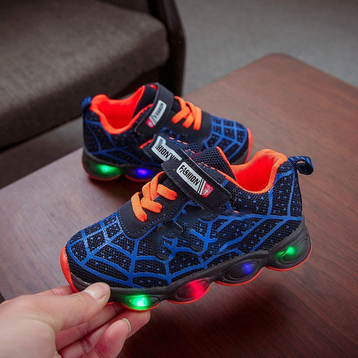 Durable kids' superhero light-up sneakers with flashing LED lights & convenient velcro straps for active boys & girls.