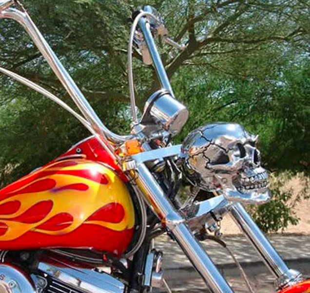 Distinctive skull LED motorcycle headlight, provides bright illumination for custom bikes & road visibility.
