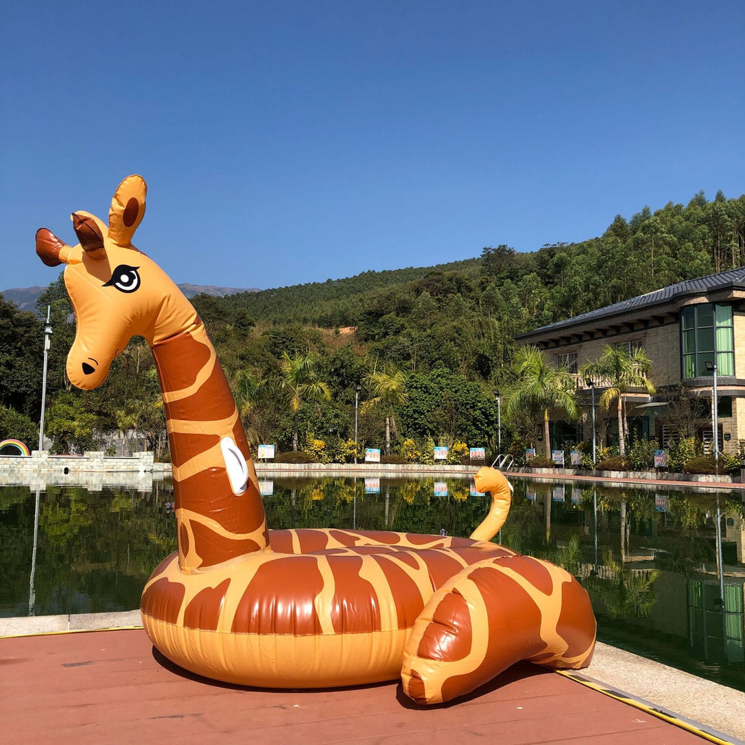 Bright yellow inflatable giraffe pool float for unisex summer water fun. Perfect for pools & beaches.