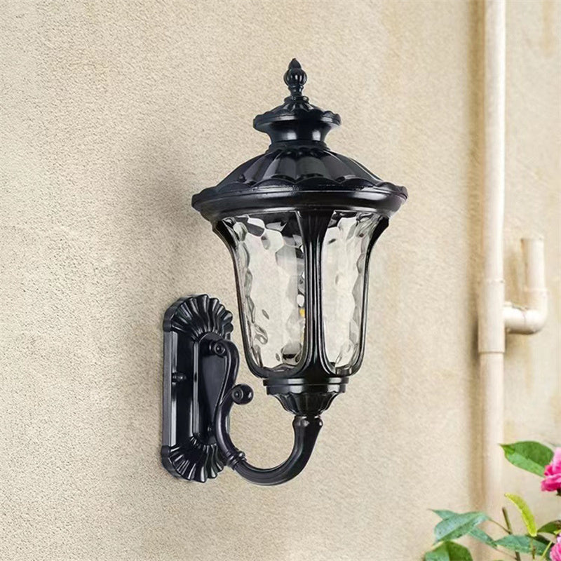 Classic outdoor wall light in bronze & black, waterproof with a sturdy glass shade.