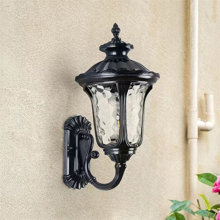 Classic outdoor wall light in bronze & black, waterproof with a sturdy glass shade.