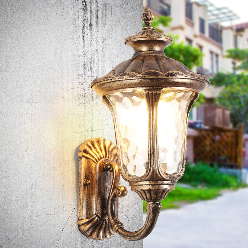 Garden wall light, weather resistant, black & bronze finish, with elegant glass shade.