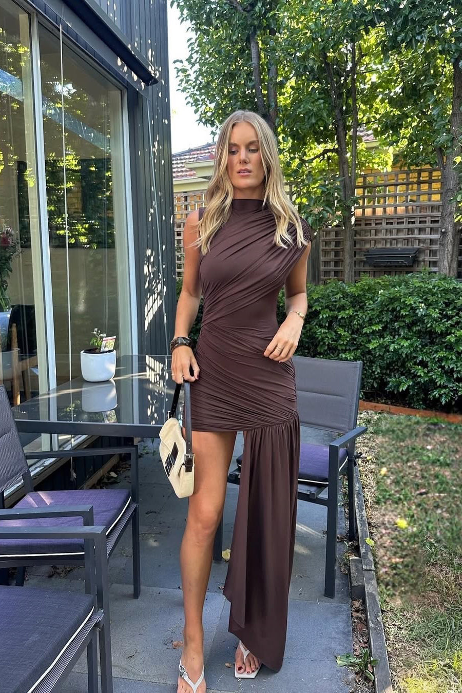 Stylish women's brown mini dress with a draped high neck & ruched bodycon fit. Ideal for cocktail & evening events.