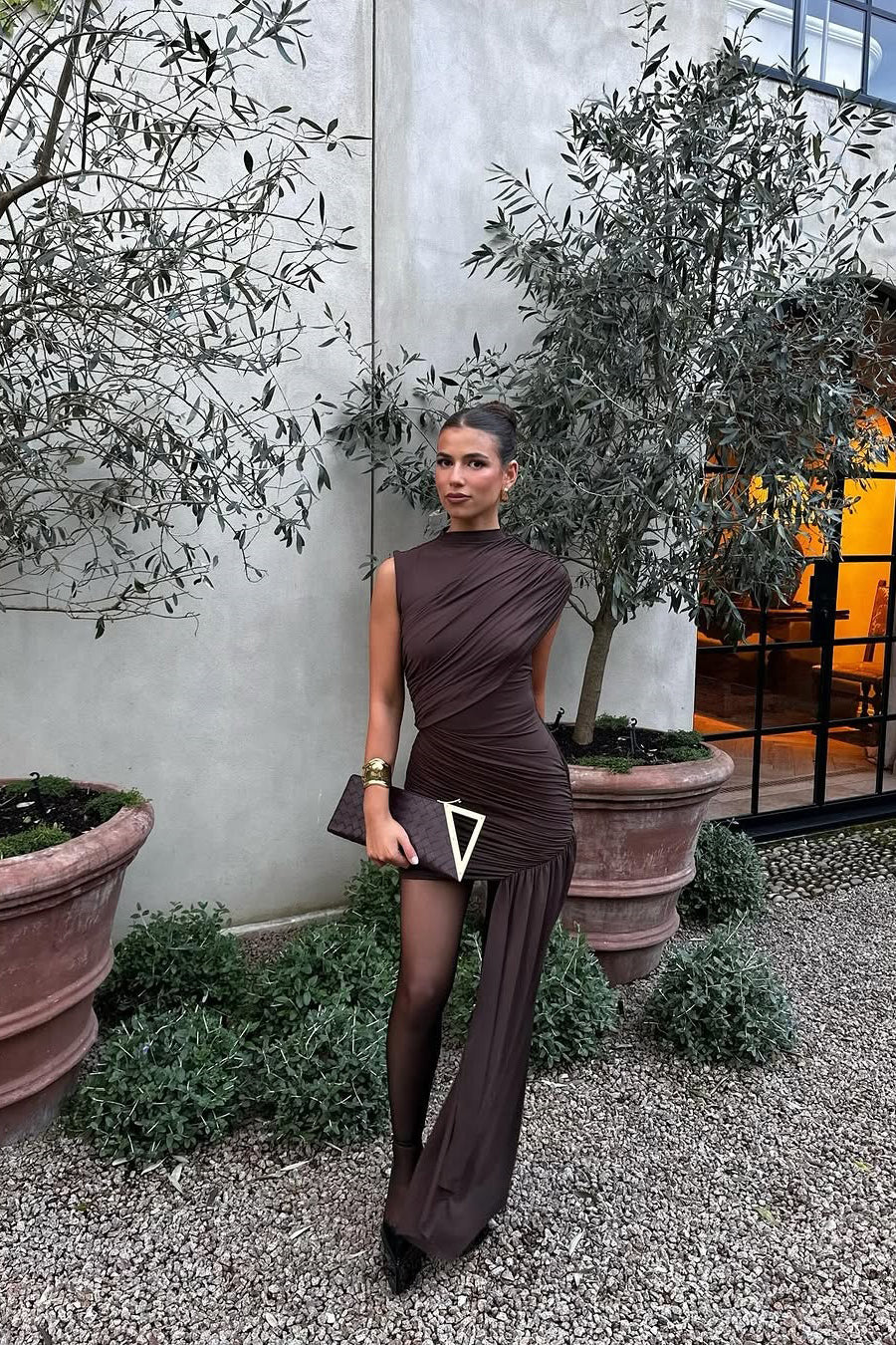 Statement brown asymmetric draped high neck ruched bodycon mini dress. Flattering women's party & evening fashion.