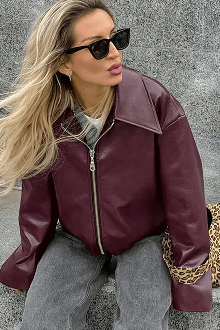 Stylish women's cropped jacket in rich burgundy, ideal for adding a modern touch to any outfit.