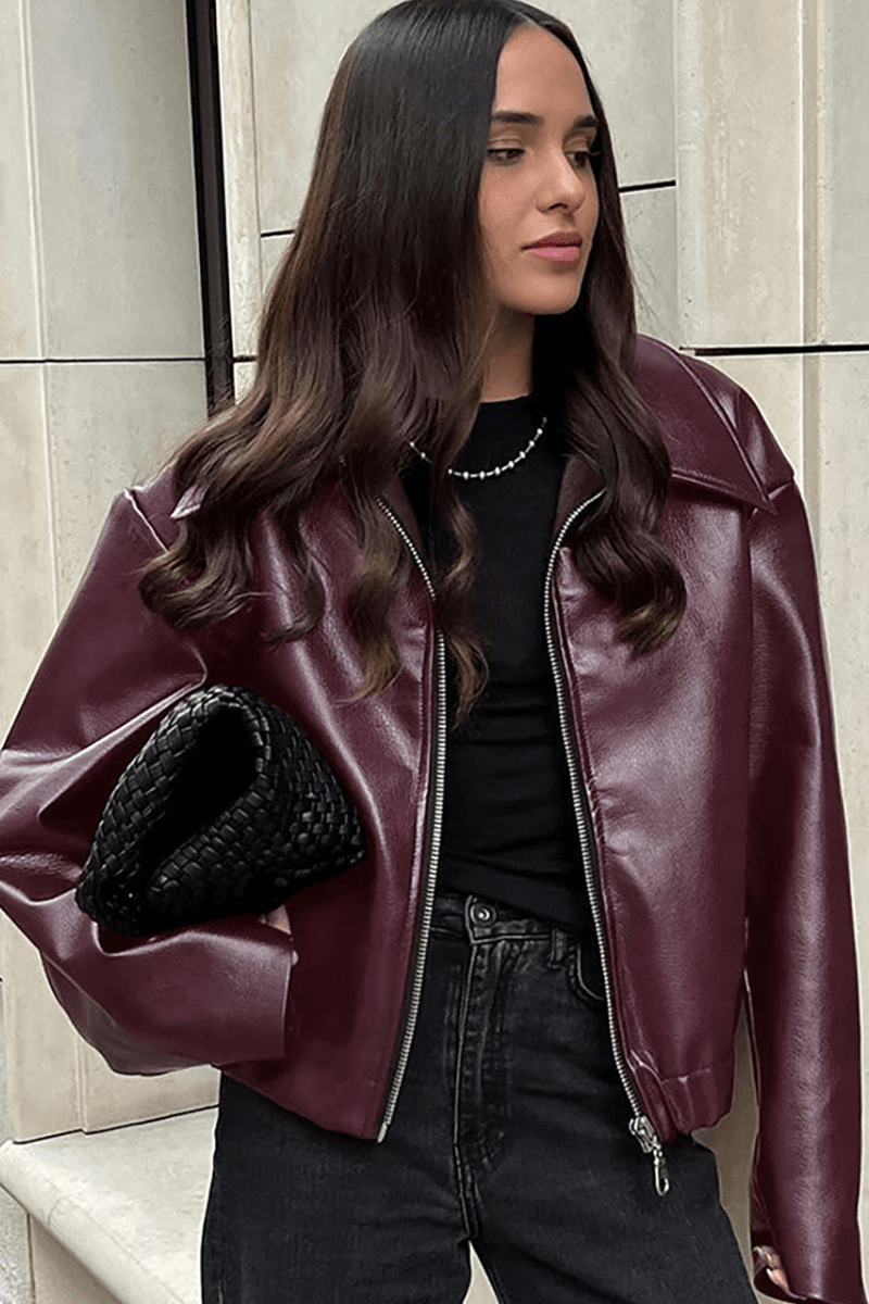 Modern cropped burgundy jacket for women, featuring a comfortable fit and chic design with zipper closure.