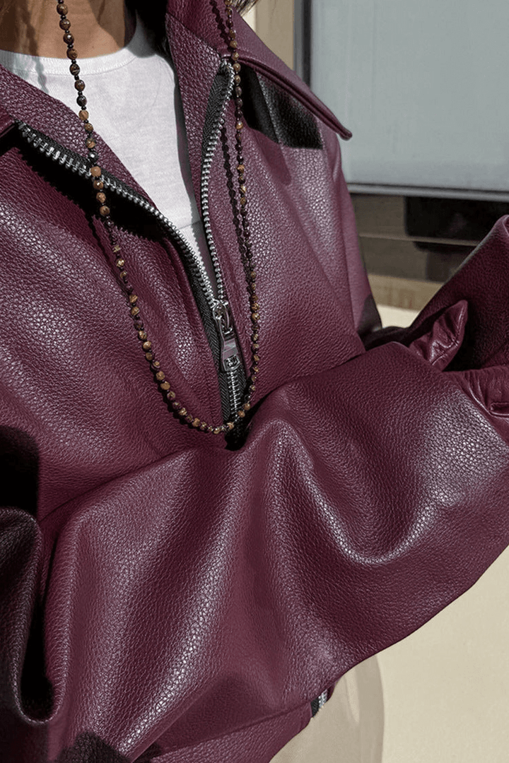 Fashionable burgundy cropped jacket for women, offering modern style and everyday comfort.