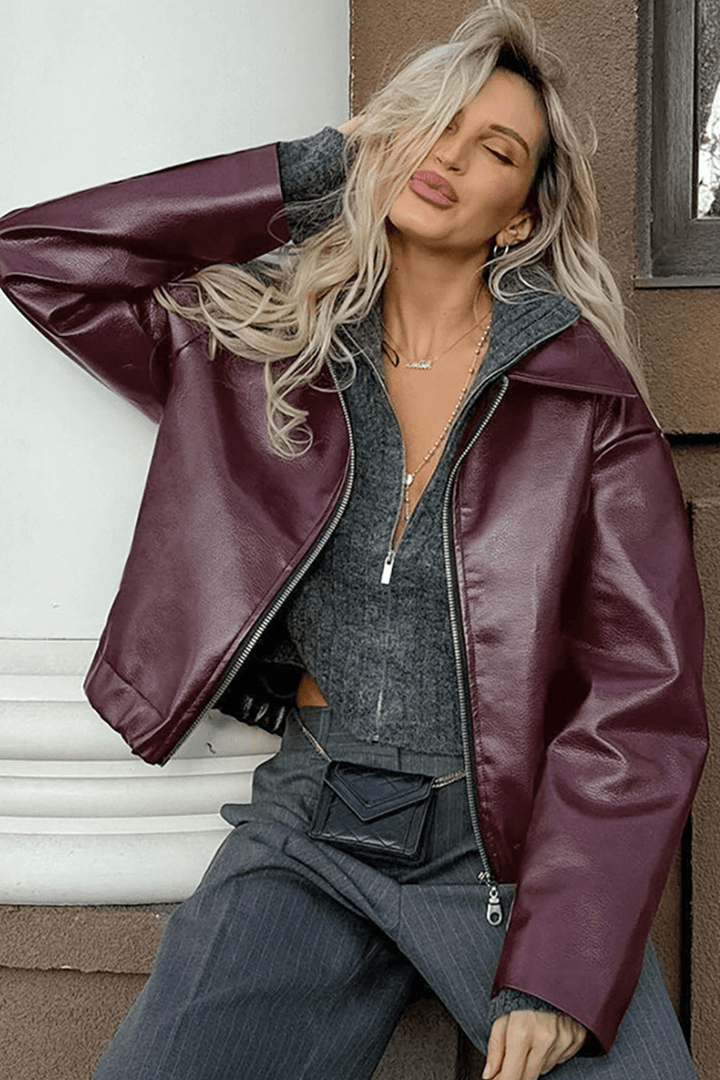 Modern women's burgundy cropped jacket, an essential piece of stylish and comfortable outerwear.