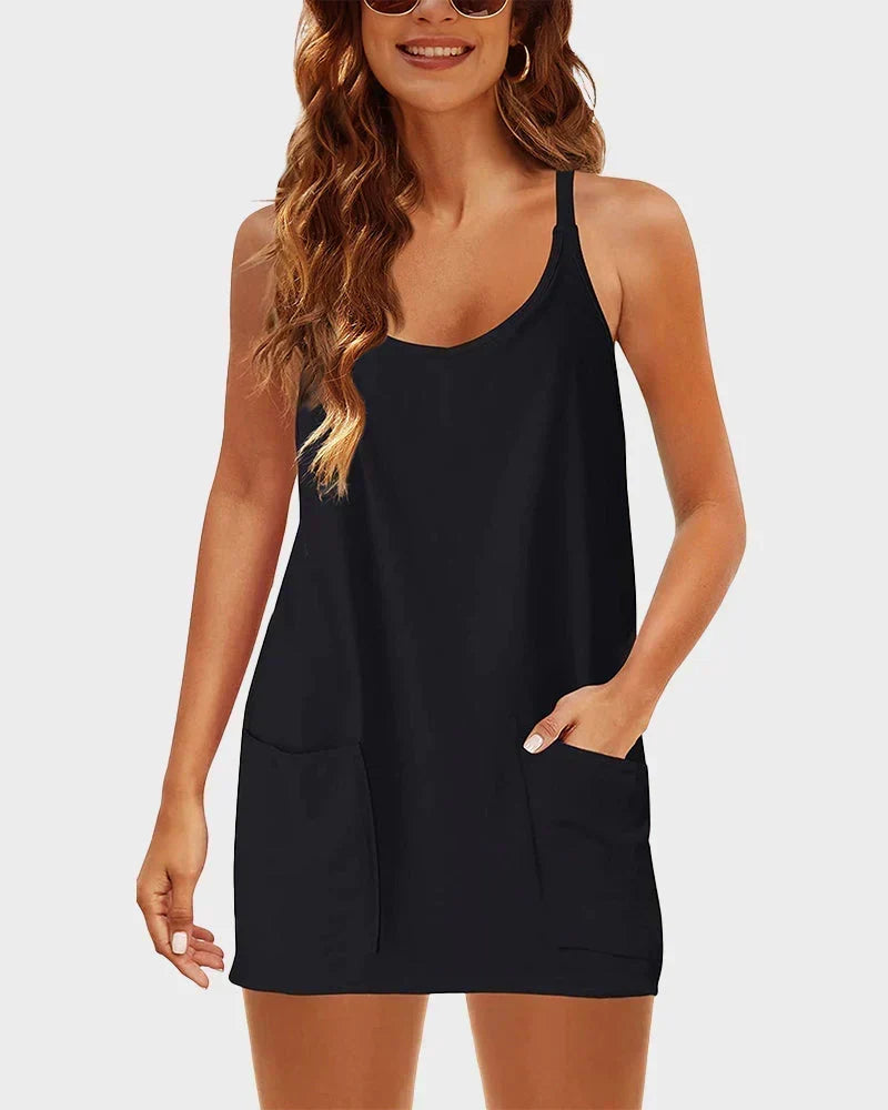 Casual women's scoop neck mini dress with built-in shorts, perfect for summer activities.