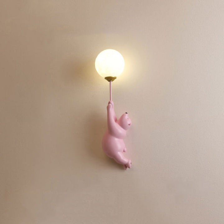 Playful bear LED wall sconce, decorative modern light for a child's bedroom or nursery.