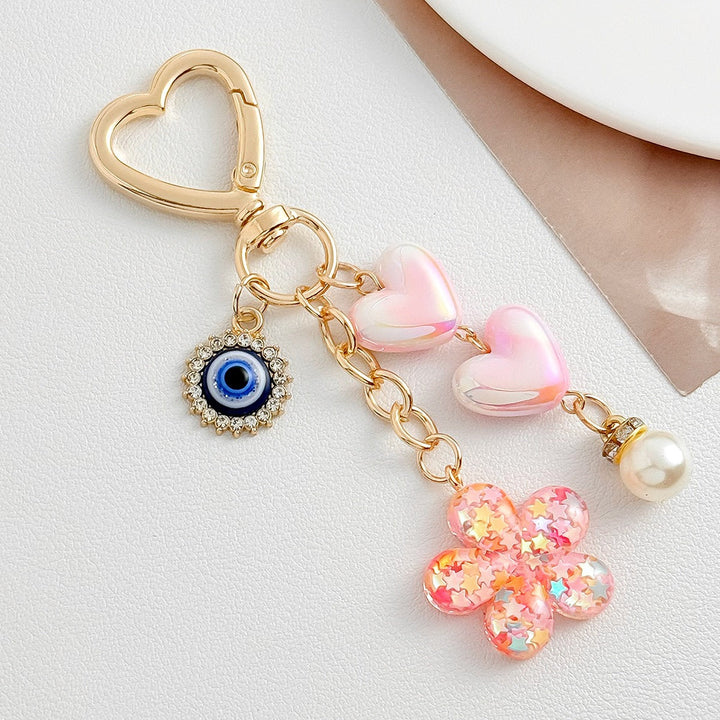 Charming heart & flower motif keychain for bags. Cute and durable fashion accessory, perfect gift for her.