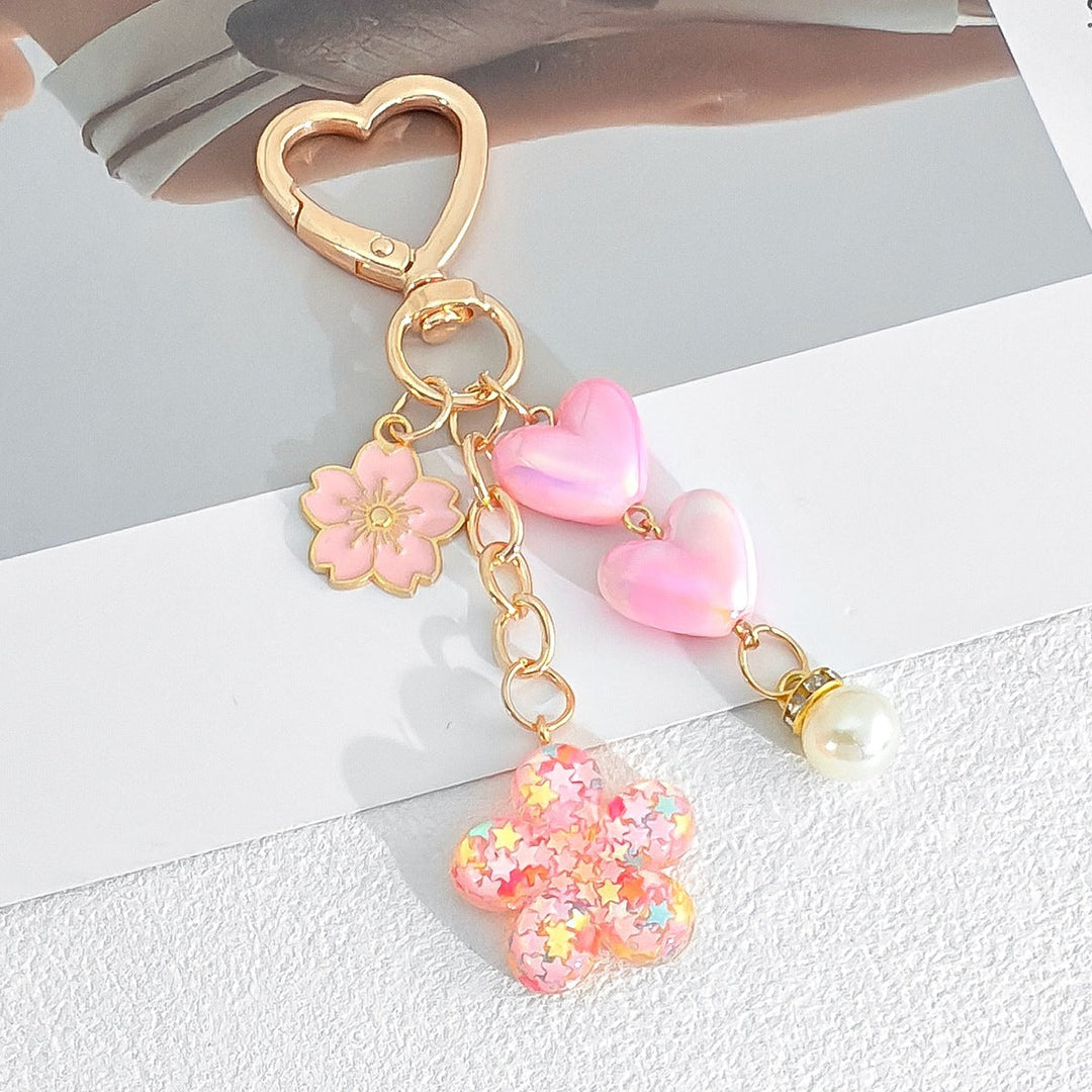 Versatile heart & flower keychain. Doubles as a cute bag charm and stylish key accessory, durable.