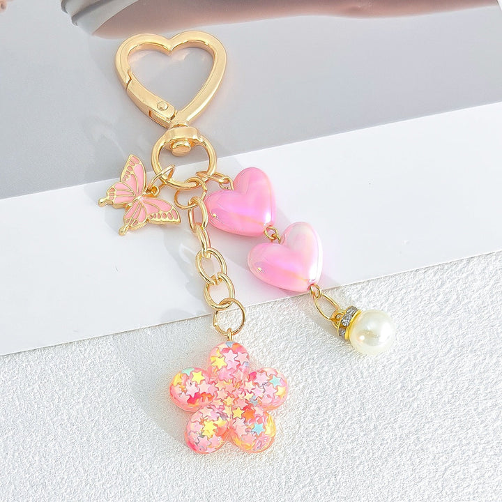 Decorative flower & heart key accessory. A charming, cute, and durable keychain for bags.