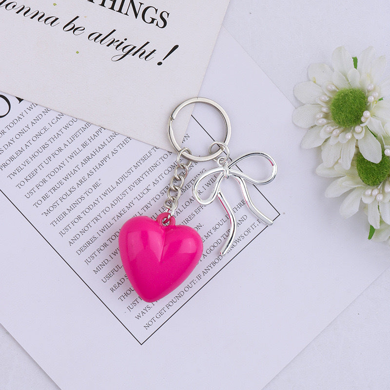 Adorable heart bag charm. Enhance your purse with this stylish keychain accessory.