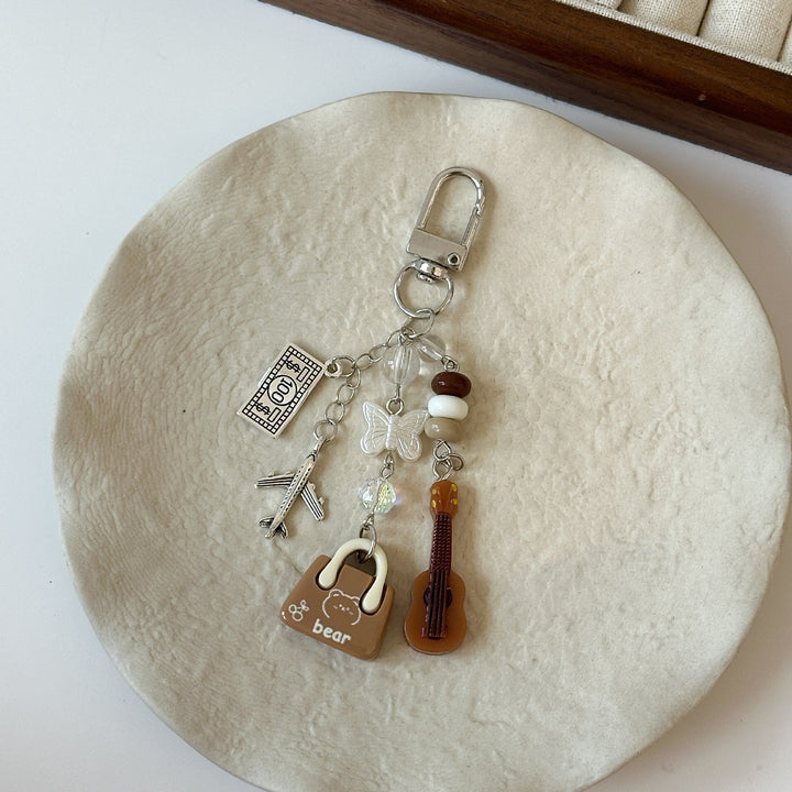 Expressive keychain charm, ideal for travel. Personalize keys or bag with this playful accessory gift.