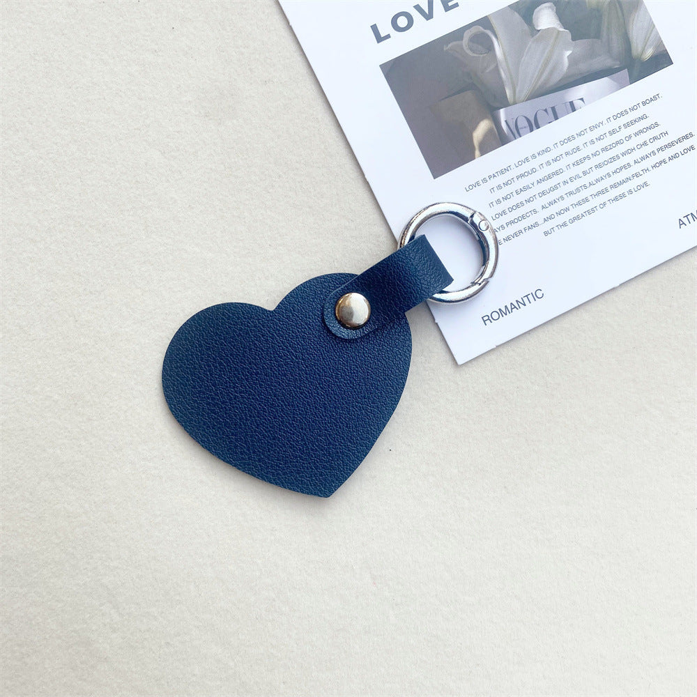 Gift-ready leather heart keychain. Beautifully crafted, ideal for keys or as a chic bag accessory.