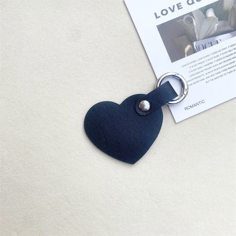 Fashionable leather heart keychain. Adds a touch of elegance to keys or as a stylish bag charm.