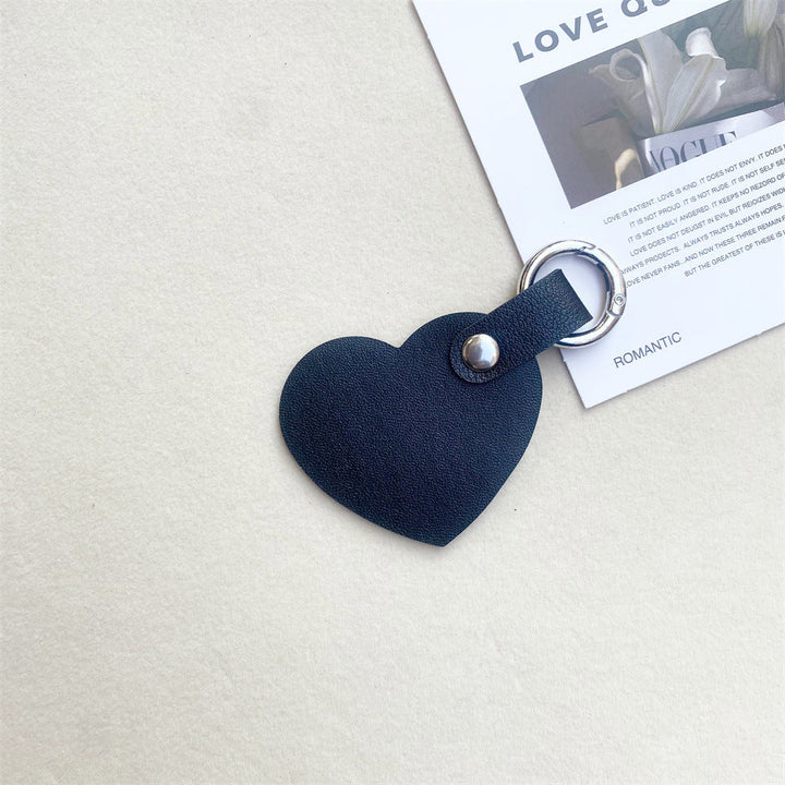 Fashionable leather heart keychain. Adds a touch of elegance to keys or as a stylish bag charm.